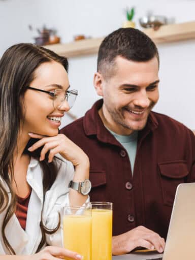 Couple looking at laptop screen